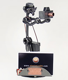 A photo of a Steelman Photographer holding a camera metal art figurine with a Business Card Holder